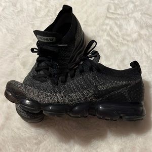 Black and grey Nike Vapormax shoes